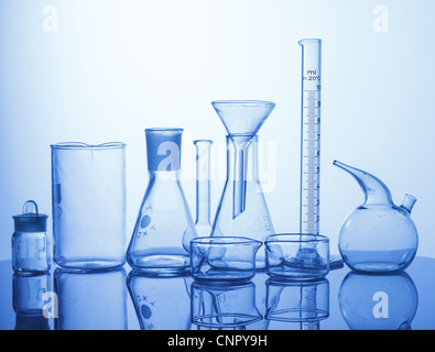 Research Lab assorted Glassware Equipment on blue background Stock Photo