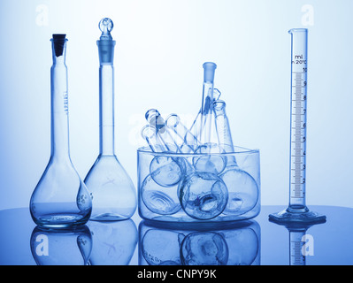 Research Lab assorted Glassware Equipment on blue background Stock Photo