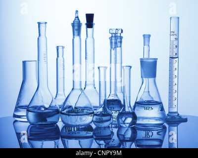 Research Lab assorted Glassware Equipment on blue background Stock Photo