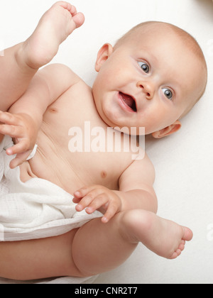 baby boy in diaper on white, blue eye Stock Photo