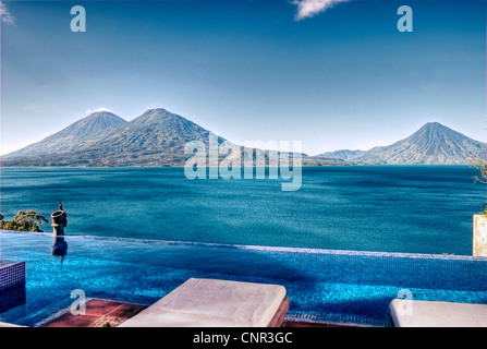 View of Lake Atitlan and Atitlan, Toliman and San Pedro volcanoes from the villa at Casa Palopo. Stock Photo