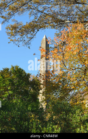 The Egyptian Obelisk known as Cleopatras Needle in Central Park with autumn color colour fall trees, New York, NY USA Stock Photo