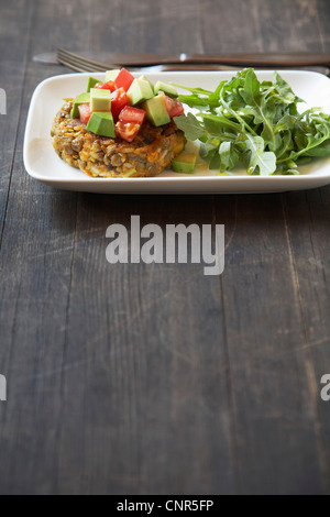 Lentil Patty with Avocado, Tomato, and Arugula Stock Photo