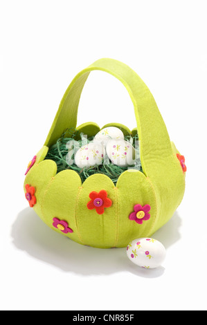 An Easter basket filled with decorated eggs Stock Photo