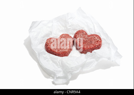 Two heart shaped beef burgers side by side Stock Photo