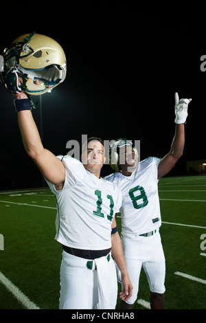 Football players celebrating victory Stock Photo