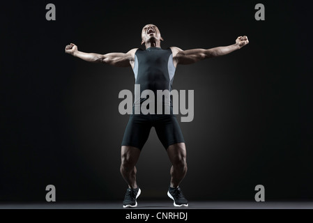 Male athlete shouting with excitement Stock Photo