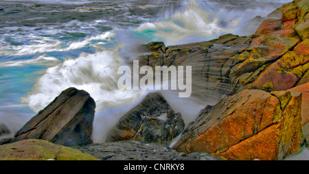 Waves hit the rocky coastline in south-western Norway, Norway Stock Photo
