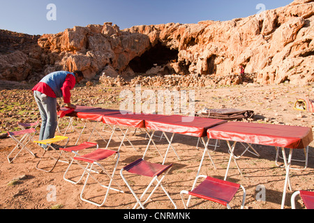 Trekkers setting up camp in the Jebel Sirwa region of the Anti Atlas mountains of Morocco, North Africa. Stock Photo