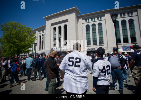 Thousands of fans arrive for the home opener at Yankee Stadium in the New York borough of The Bronx Stock Photo