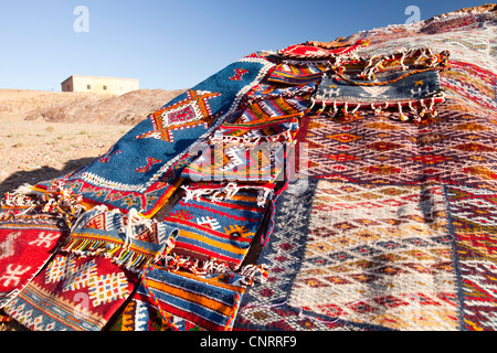 Berber Moroccan woven cloth rugs and bags in the Anti Atlas mountains of Morocco, North Africa. Stock Photo