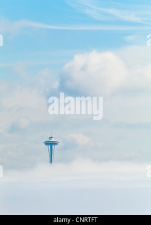 A fog bank obscures downtown Seattle and the Space Needle sticks up through the fog, Washington USA Stock Photo