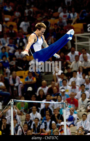 GYMNASTICS Paul Hamm (USA) competing on the high bar during the men's individual all around finals, where he won the gold medal Stock Photo