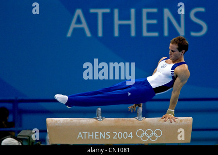 GYMNASTICS Paul Hamm (USA) competing on the pommel horse during the men's individual all around finals, where he won the gold Stock Photo