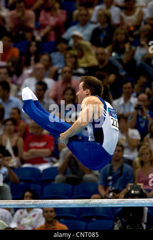 GYMNASTICS Paul Hamm (USA) competing on the parallel bars during the men's individual all around finals, where he won the gold Stock Photo