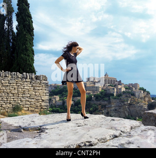 woman in minidress enjoying the view, France, Provence, Cordes Stock Photo