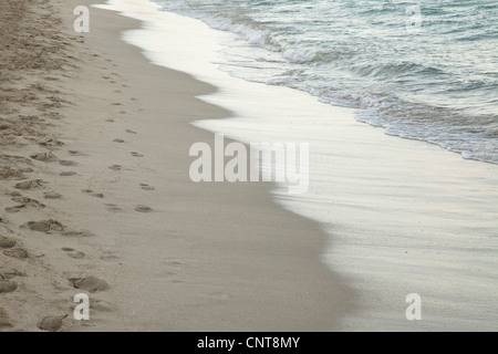 Wave washing onto shore Stock Photo