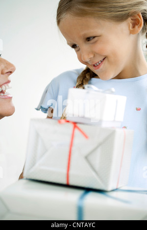 Girl giving her mother gifts Stock Photo