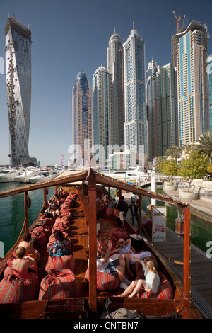 The skyscrapers of the 'Dubai Marina' area seen from a traditional dhow (Dubai - the United Arab Emirates). Stock Photo