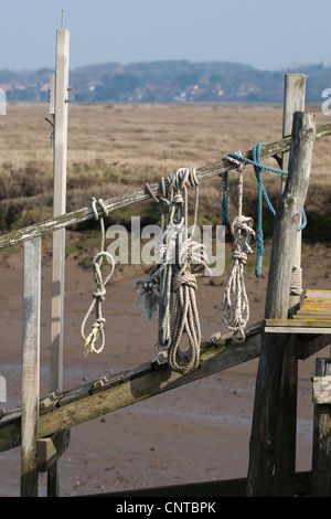 Hanging tied ropes in Morston Harbour, Norfolk Stock Photo