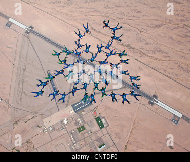 Members of the US Air Force Academy jump team, Wings of Blue, set a world collegiate skydiving record when 46 jumpers linked together March 31, 2012, at Gila Bend Auxiliary Field, AZ. Stock Photo