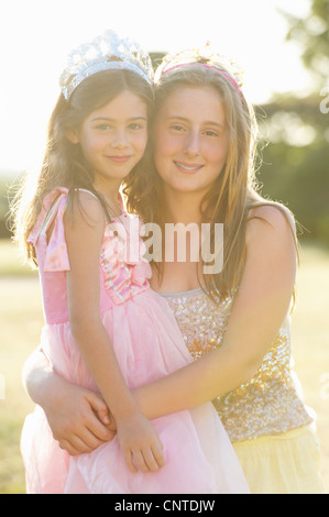 Sisters smiling together outdoors Stock Photo