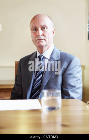 Businessman sitting in cafe Stock Photo