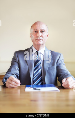 Businessman sitting in cafe Stock Photo