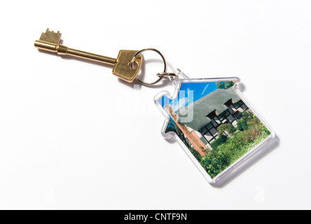 house shaped key ring fob on white background Stock Photo