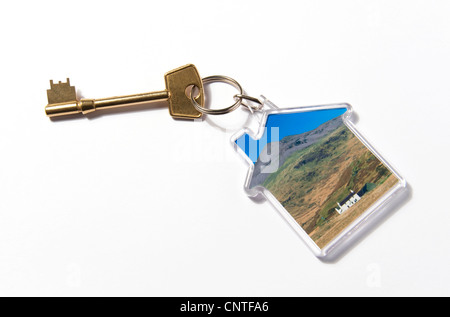 house shaped key ring fob on white background Stock Photo