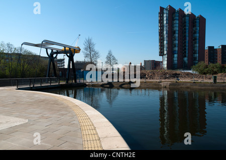 Islington Wharf apartment block and bascule lifting bridge, New Islington, Ancoats, Manchester, England, UK Stock Photo