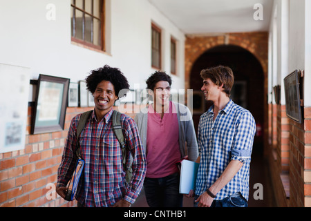 Students walking together in hallway Stock Photo