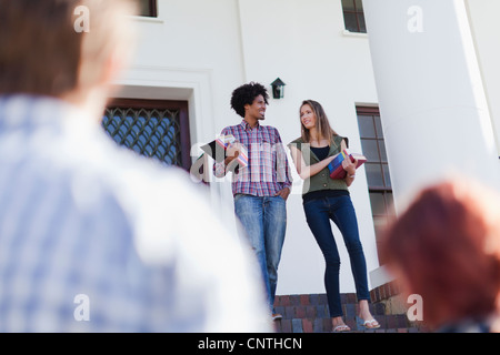 Students walking together on campus Stock Photo