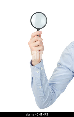 Man's hand holding magnifying glass Stock Photo