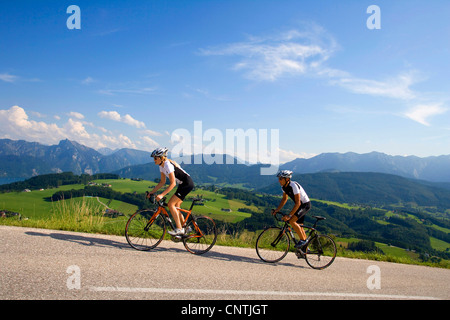 man and woman with racing bike on a tour in the alpine mountains, Austria, Upper Austria, Gmunden Stock Photo