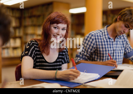 Students studying together in library Stock Photo
