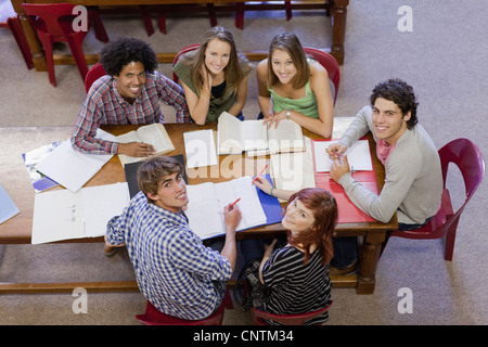 Students studying together in library Stock Photo