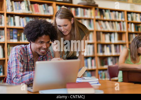 Students studying together in library Stock Photo