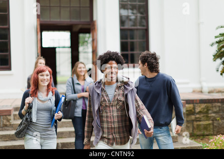 Students walking together on campus Stock Photo