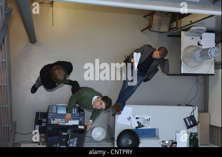 Overhead view of businessmen in office Stock Photo