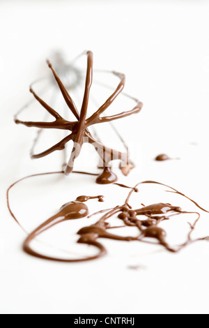Chocolate batter on whisk