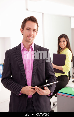 Businessman carrying tablet computer