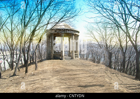 roman style old gazebo against the blue sky of early spring Stock Photo