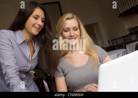 Mother and daughter using laptop Stock Photo