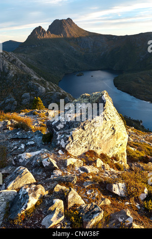 Sunset on quartzite rocks and Cradle Mountain in Cradle Mountain - Lake St Clair National Park Tasmania Australia Stock Photo