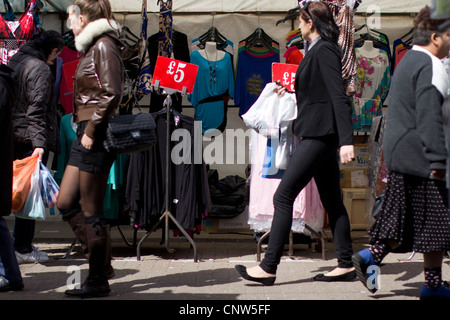 Walthamstow high street London, shoppers in Walthamstow market with pricing signs Stock Photo