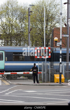 Highams Park Station level crossing, north east London uk Stock Photo