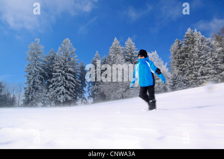 boy frolicly playing in the snow, Switzerland Stock Photo