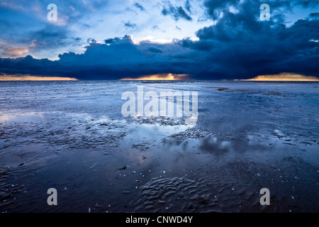 Storm clouds roll across the Wash towards the beach at Snettisham in Norfolk Stock Photo