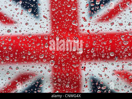 Raindrops on glass in front of a Union jack flag Stock Photo